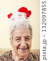 portrait of happy old woman wears Santa Claus hat for new year 132097855