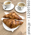 croissants and espresso coffee cups on wooden table in caf 132097860