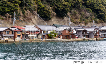 Traditional wooden fishermen Funaya boathouses in Ine, north Kyoto prefecture on the Sea of Japan Traditional wooden fishermen Funaya boathouses in Ine, north Kyoto prefecture on the Sea of Japan 132098109