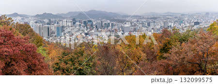 Aerial panoramic cityscape view of downtown Seoul, capital of South Korea with Autumn foliage in the foreground Aerial panoramic cityscape view of downtown Seoul, capital of South Korea with Autumn foliage in the foreground 132099575