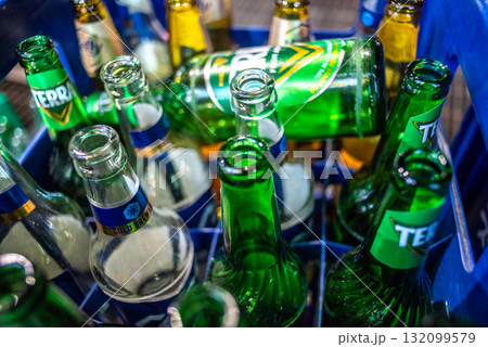 Close-up of empty Korean beer bottles in a blue crate in Seoul, South Korea Close-up of empty Korean beer bottles in a blue crate in Seoul, South Korea 132099579