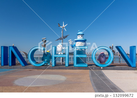 Colorful Incheon sign with cartoon characters and wind turbine in Incheon, South Korea Colorful Incheon sign with cartoon characters and wind turbine in Incheon, South Korea 132099672