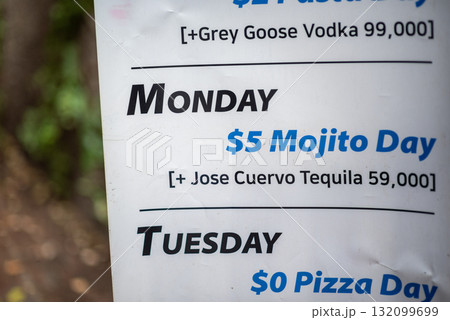 Weekly drink specials sign with Mojito, vodka and pizza in a bar in Itaewon district in Seoul, South Korea Weekly drink specials sign with Mojito, vodka and pizza in a bar in Itaewon district in Seoul, South Korea 132099699