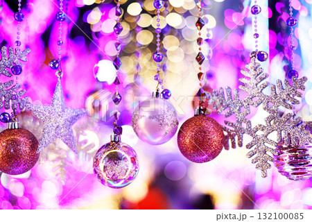Colorful Baubles and Balls hanging decorated on christmas tree with bokeh light background Colorful Baubles and Balls hanging decorated on christmas tree with bokeh light background 132100085