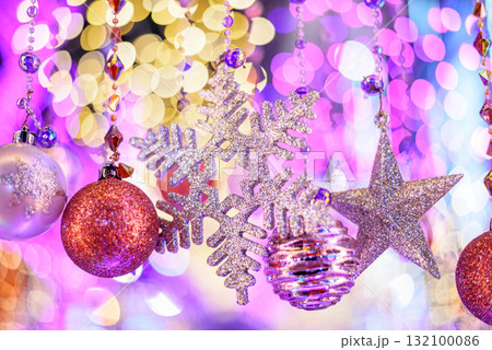 Colorful Baubles and Balls hanging decorated on christmas tree with bokeh light background Colorful Baubles and Balls hanging decorated on christmas tree with bokeh light background 132100086