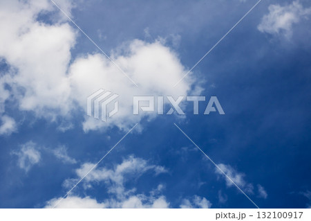 Serene Blue Sky with Fluffy White Cumulus Clouds - Clean Nature Background 132100917