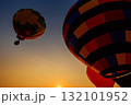 Silhouette hot air balloon over mountains in sunset sky 132101952