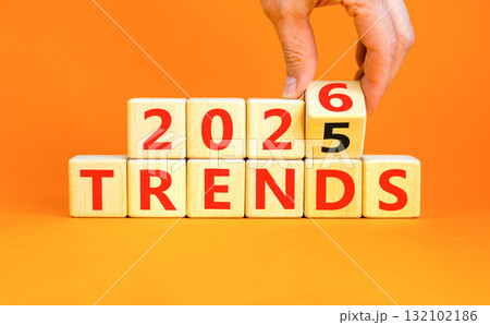 2026 Trends new year symbol. Concept words 2026 Trends on beautiful wooden blocks. Beautiful orange paper background. Businessman's hand. Business and 2026 Trends new year concept. Copy space. 2026 Trends new year symbol. Concept words 2026 Trends on beautiful wooden blocks. Beautiful orange paper background. Businessman's hand. Business and 2026 Trends new year concept. Copy space. 132102186