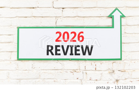 2026 Review symbol. Concept words 2026 Review on beautiful white sign with arrow. Beautiful old white brick wall background. Business and 2026 review concept. Copy space. 132102203