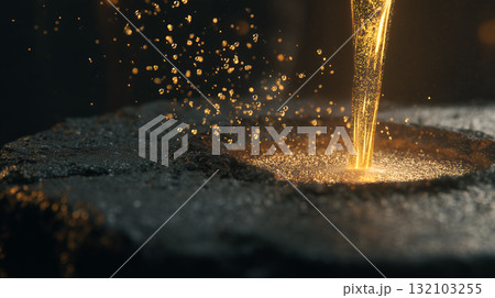 Molten Metal Stream Pouring into Mold on Granular Surface 132103255