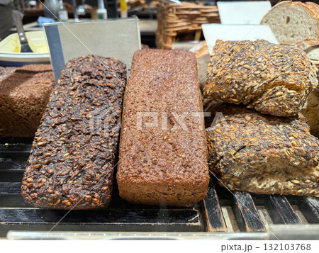 Rustic rye loaf on bakery counter display 132103768
