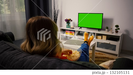 Woman Watching Green Chroma Key Screen TV, Relaxing. 132105131