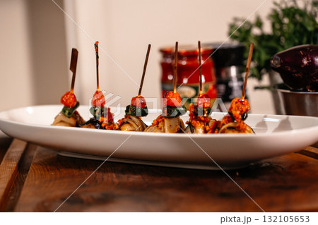 Fried Eggplant with Peppers, tomatoes and Appetizing Fried Beef Meatballs. 132105653