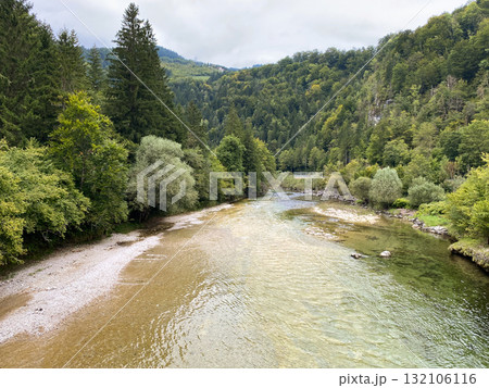 Peaceful Mountain River Flowing Calmly Through Valley Peaceful Mountain River Flowing Calmly Through Valley 132106116