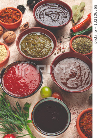 assortment of Georgian sauces and spices, top view, set of spices and tkemali, Georgian, food background, assortment of Georgian sauces and spices, top view, set of spices and tkemali, Georgian, food background, 132106368