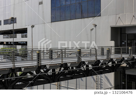 Pedestrian pathway or corridor or hallway between building. Pedestrian pathway or corridor or hallway between building. 132106476