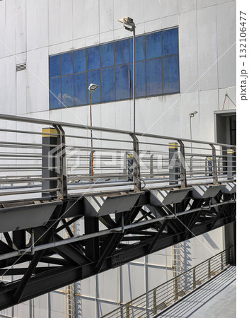 Pedestrian pathway or corridor or hallway between building. Pedestrian pathway or corridor or hallway between building. 132106477