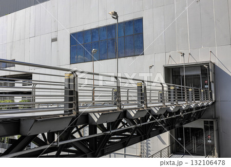 Pedestrian pathway or corridor or hallway between building. Pedestrian pathway or corridor or hallway between building. 132106478