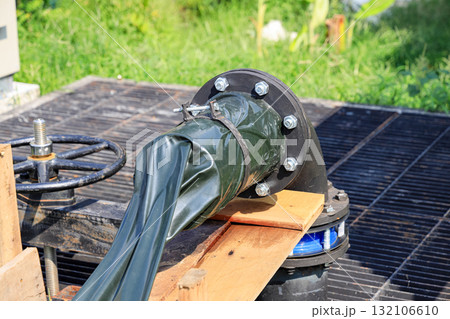 Dewatering pump with connected pipes and hoses of flood management system.  132106610