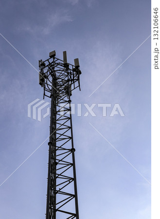 Wireless Communication Antenna pole, Mobile phone mast antenna pole on top of dilapidated building. Wireless Communication Antenna pole, Mobile phone mast antenna pole on top of dilapidated building. 132106646