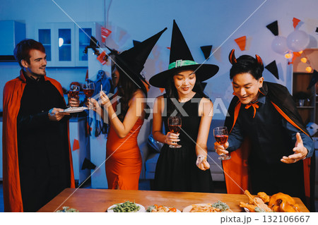 Joyful office Halloween party with coworkers in costumes, celebrating with drinks and laughter, fostering teamwork and festive spirit Joyful office Halloween party with coworkers in costumes, celebrating with drinks and laughter, fostering teamwork and festive spirit 132106667