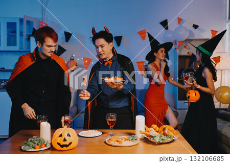 Joyful office Halloween party with coworkers in costumes, celebrating with drinks and laughter, fostering teamwork and festive spirit 132106685
