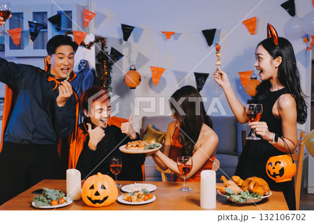 Joyful office Halloween party with coworkers in costumes, celebrating with drinks and laughter, fostering teamwork and festive spirit Joyful office Halloween party with coworkers in costumes, celebrating with drinks and laughter, fostering teamwork and festive spirit 132106702