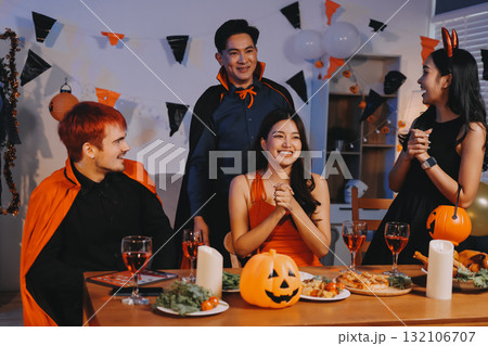 Joyful office Halloween party with coworkers in costumes, celebrating with drinks and laughter, fostering teamwork and festive spirit Joyful office Halloween party with coworkers in costumes, celebrating with drinks and laughter, fostering teamwork and festive spirit 132106707