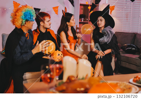 Joyful office Halloween party with coworkers in costumes, celebrating with drinks and laughter, fostering teamwork and festive spirit Joyful office Halloween party with coworkers in costumes, celebrating with drinks and laughter, fostering teamwork and festive spirit 132106720