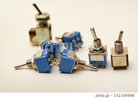 Small electric switches. Electric toggle switch. Blue switches. Small electric switches. Electric toggle switch. Blue switches. 132106996