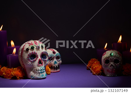 Day of the Dead Scene. Decorative sugar skulls with candles and marigolds Day of the Dead Scene. Decorative sugar skulls with candles and marigolds 132107149