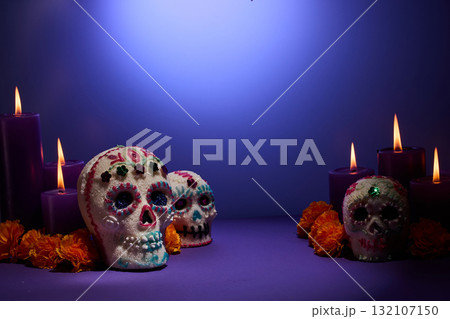 Day of the Dead Scene. Decorative sugar skulls with candles and marigolds 132107150