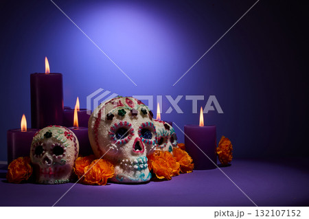 Day of the Dead Scene. Decorative sugar skulls with candles and marigolds 132107152