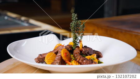 Beef Meal Presentation on White Plate . Chef Specialty Dish. Beef Meal Presentation on White Plate . Chef Specialty Dish. 132107202