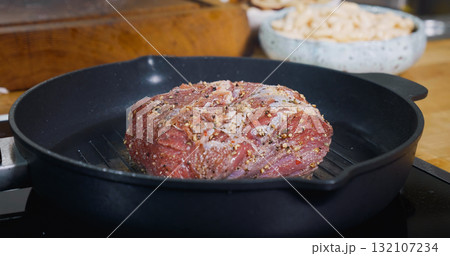 Delicious Juicy Meat Steak Cooking on Grill. Hot Pan. Close Up. Delicious Juicy Meat Steak Cooking on Grill. Hot Pan. Close Up. 132107234