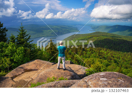 Hiker on Black Mountain Overlooking Lake George, New York State, USA Hiker on Black Mountain Overlooking Lake George, New York State, USA 132107463
