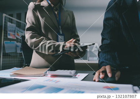 Close up high angle Asian businesswoman working with her coworker in meeting room 132107807