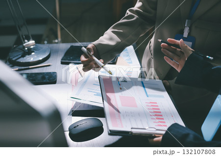 Close up high angle Asian businesswoman working with her coworker in meeting room 132107808