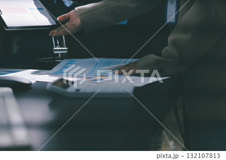Close up high angle Asian businesswoman working with her coworker in meeting room 132107813