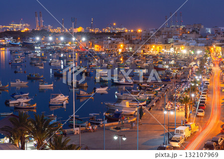 Marsaxlokk harbor with boats at night, Malta 132107969
