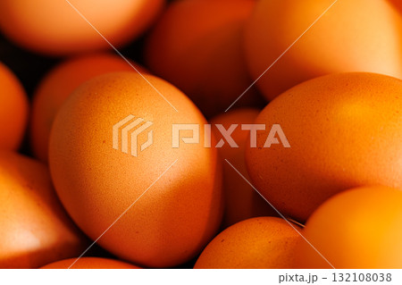 Fresh brown eggs gathered from the farm ready for cooking and baking in a cozy kitchen setting 132108038