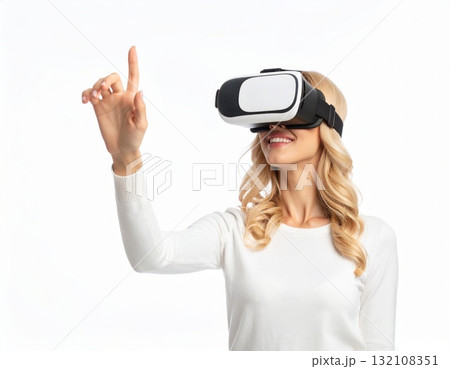 Woman wearing VR glasses and trying to touch something in the air, over white background Woman wearing VR glasses and trying to touch something in the air, over white background 132108351