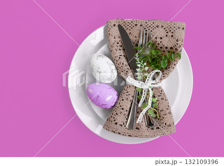 Easter celebration concept. Top view Napkin white plate eggs, isolated background, banner 132109396