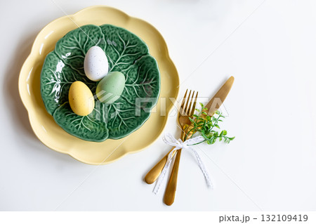 Easter celebration concept. Top view vertical green yellow plate eggs, isolated background, banner Easter celebration concept. Top view vertical green yellow plate eggs, isolated background, banner 132109419