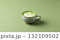 Matcha Latte Art in Ceramic Cup on Light Green Background 132109502