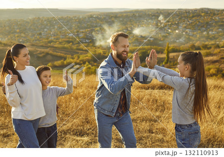 Father Giving High Five to Daughter in Nature Father Giving High Five to Daughter in Nature 132110913