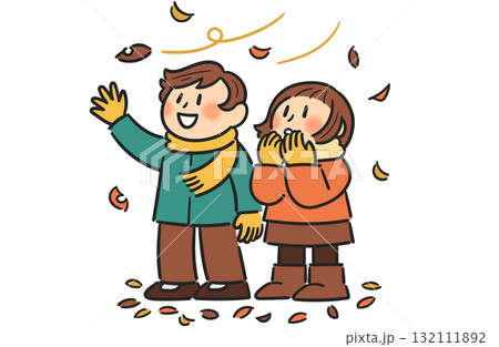 風に舞う落ち葉を見つめる男の子と女の子 風に舞う落ち葉を見つめる男の子と女の子 132111892