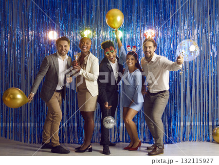 Group of happy friends drinking champagne and having fun at Christmas or New Year party 132115927