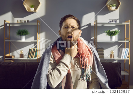 Sick man with touching his neck suffering from sore throat 132115937