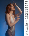 Beauty woman in studio showcasing body art with tape and fur elements 132115973